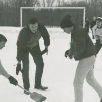 Students playing sports in the snow.